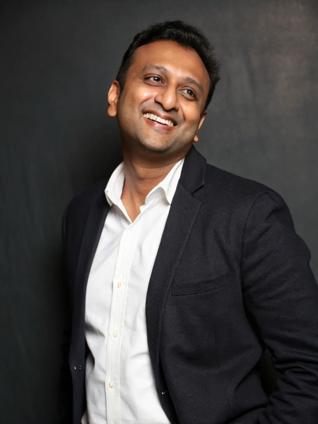 A professional headshot of a data science instructor with a PhD, smiling confidently, used to represent the expertise of the instructors.